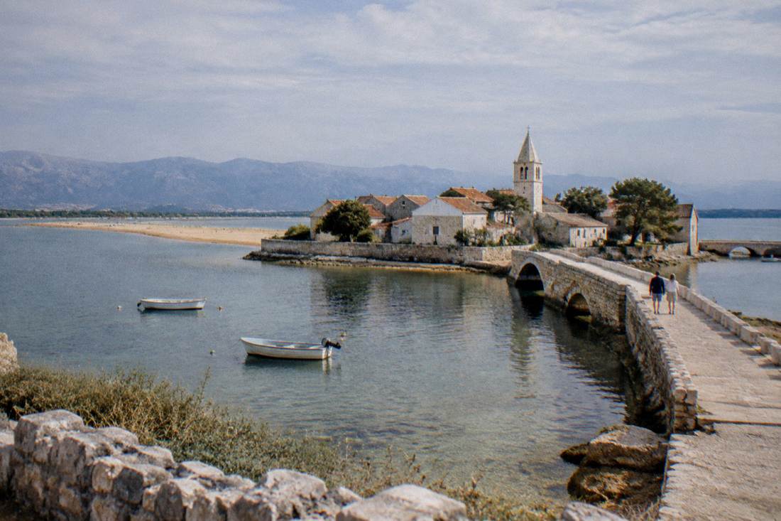 Nin, a tiny old town on a lagoon island joined by short stone bridges, low stone houses and shallow water
