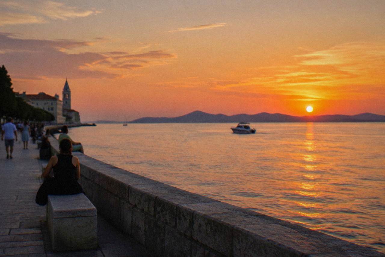 Sunset over the Adriatic from Zadar's waterfront with islands on the horizon