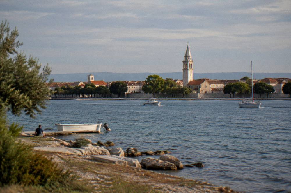 Old Town skyline and bell tower seen across the water from Arbanasi