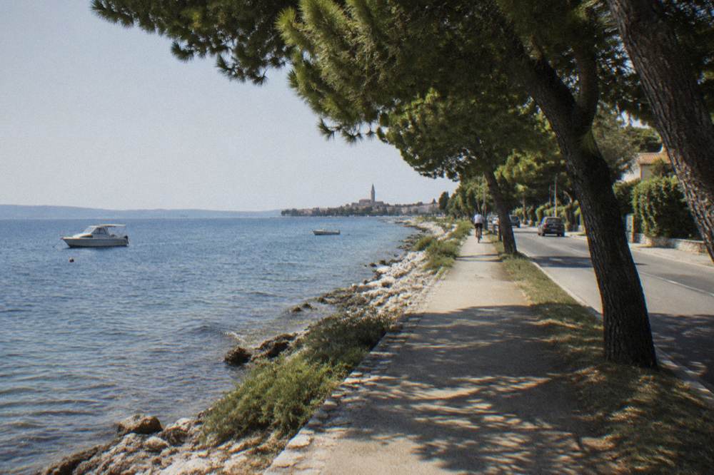 Coastal path from Diklo toward Zadar with a distant cyclist