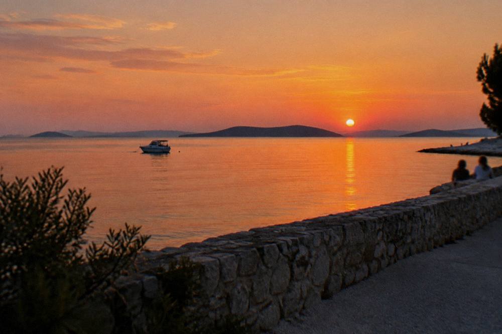Sunset over the channel from the Diklo shore in soft natural light