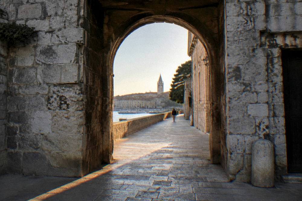 View through the gate arch to the paved passage into the Old Town