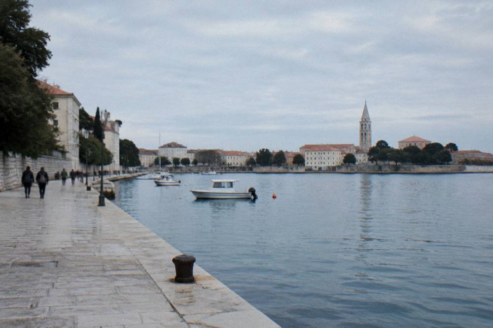 Old Town waterfront with a sea wall and calm blue water