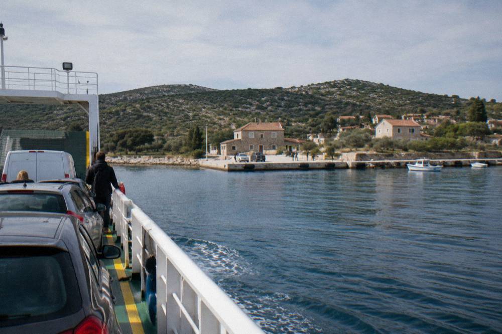 Car ferry approaching a small stone quay on Dugi Otok