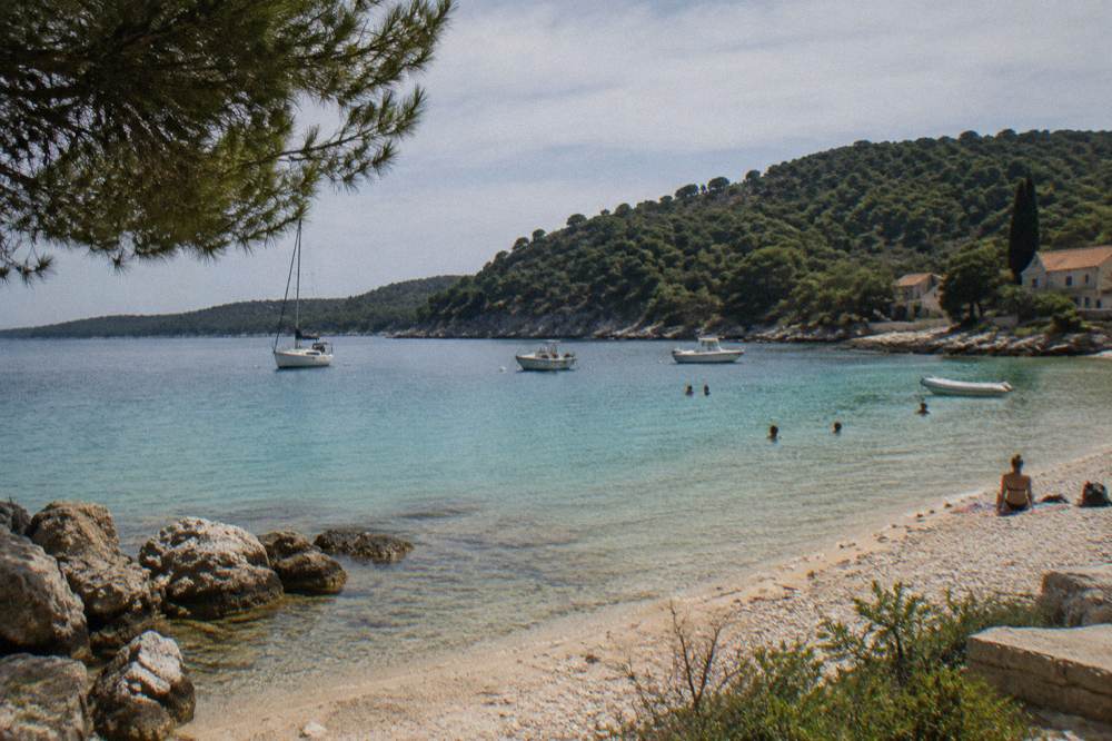 Sandy bay with turquoise shallows and pines on Dugi Otok