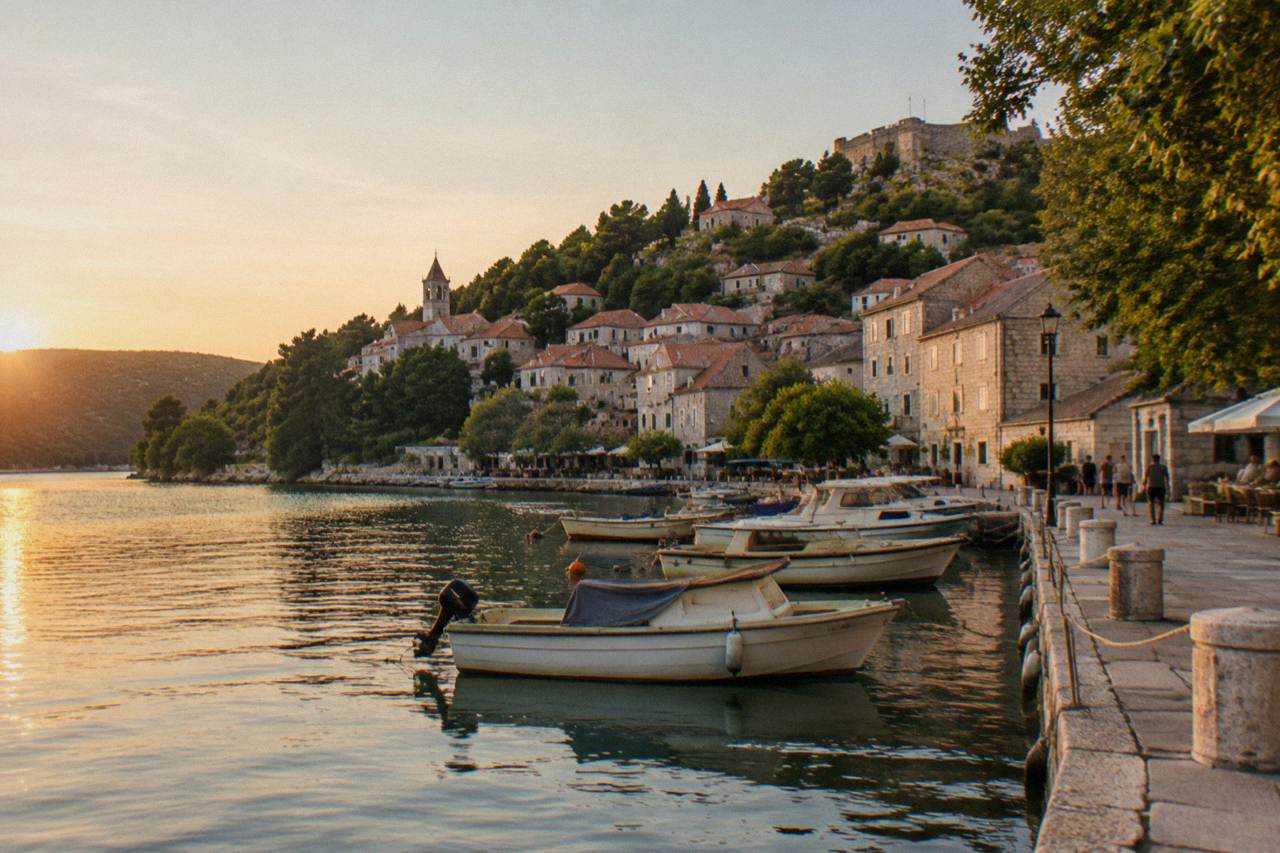 Skradin riverside town with a stone quay and moored boats
