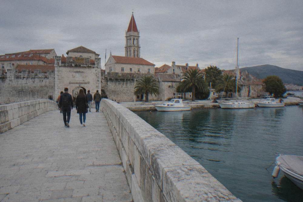Stone bridge leading to Trogir island across a narrow channel
