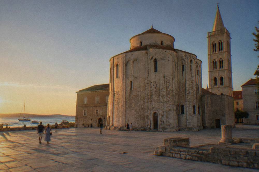 The round stone Church of St Donatus standing in a wide paved square in Zadar.