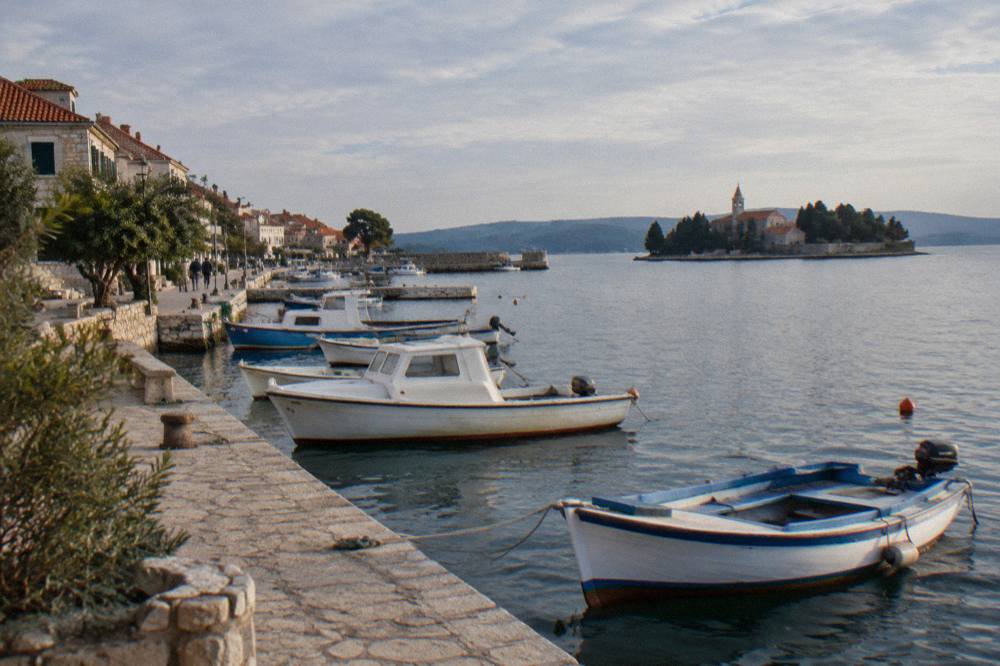Fishing boats and a stone quay in the small harbour of Preko on Ugljan island.
