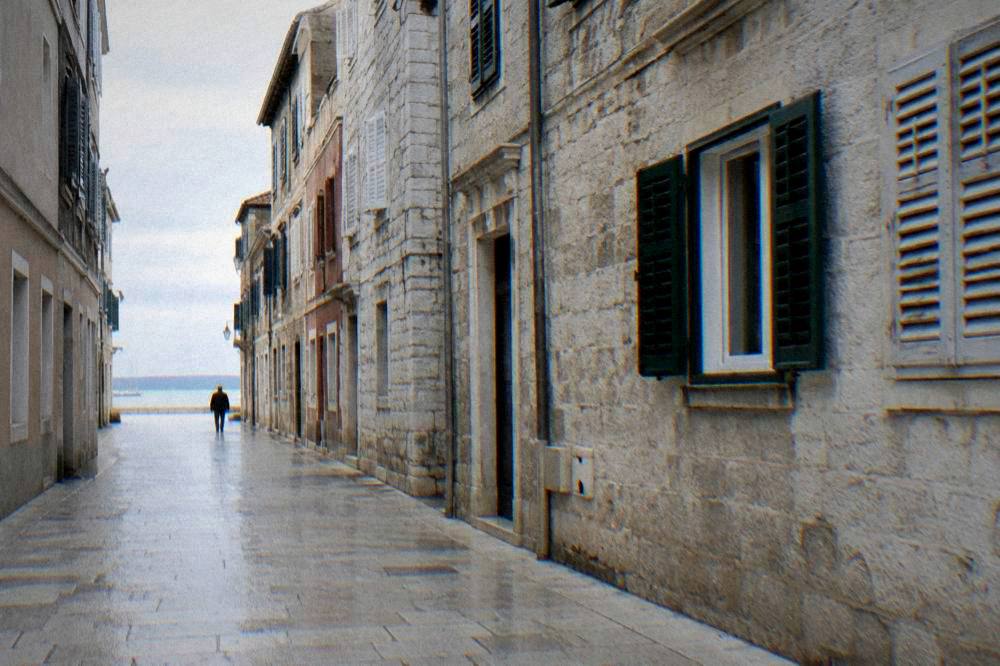 An empty Kalelarga street in early morning light in Zadar.