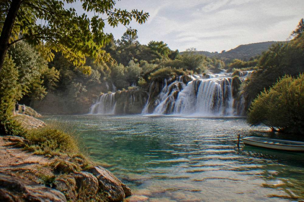 Late-afternoon light on a green pool below the falls at Skradinski Buk.