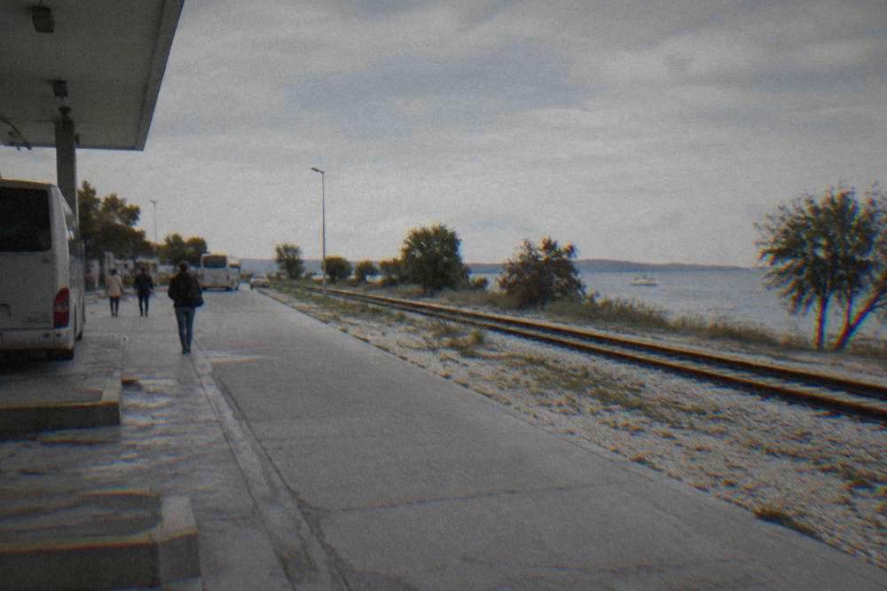 Plain tracks and a gravel platform edge near Zadar bus station.