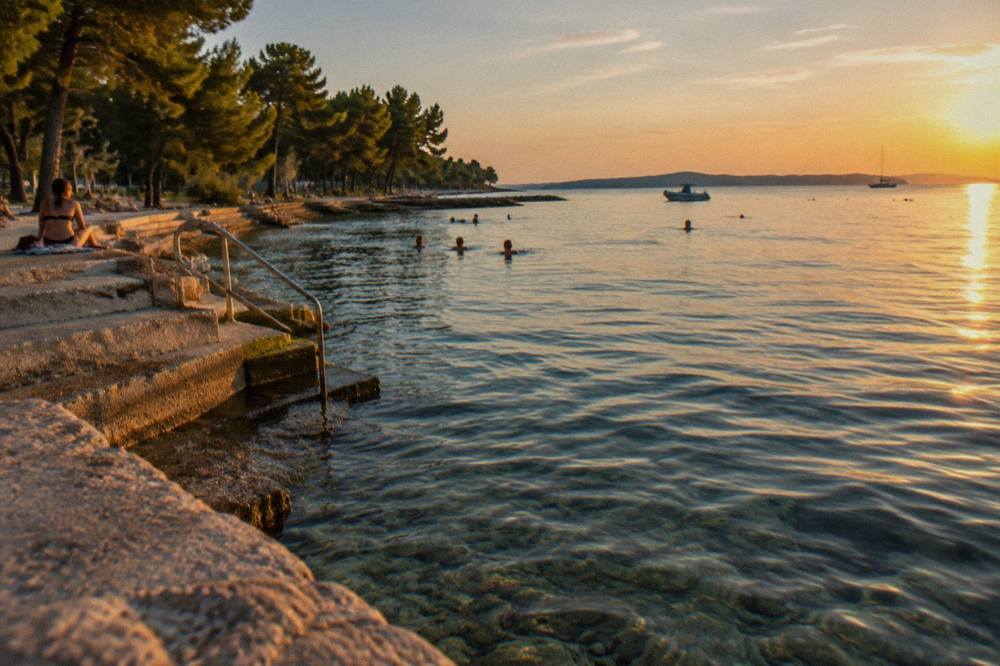 Calm clear water and steps into the sea at Kolovare Beach in Zadar.