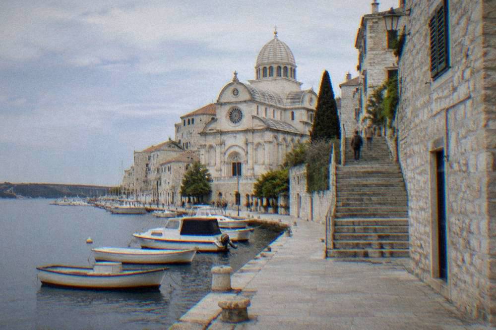 Šibenik cathedral and narrow limestone steps rising from the waterfront.