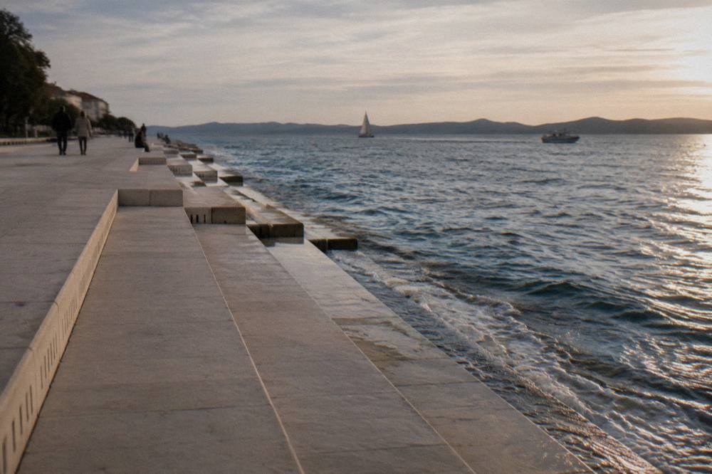 The Sea Organ steps beside the sea in late afternoon sun in Zadar.