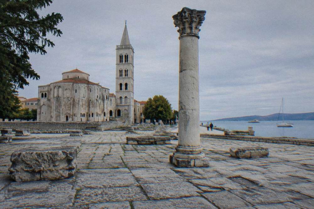 A Roman column and stone slabs in the Roman Forum square in Zadar.
