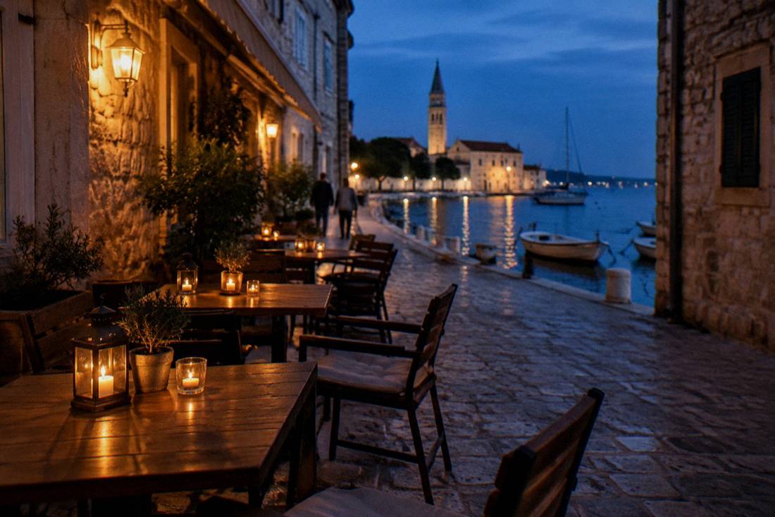 Restaurant terrace tables with lanterns in a narrow Zadar lane at dusk