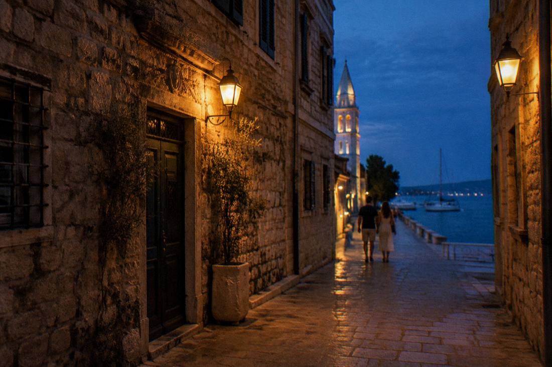 A warmly lit stone lane in Zadar old town at dusk