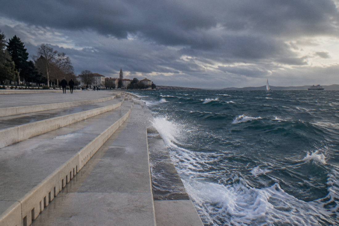 Whitecaps and dramatic clouds over the Zadar waterfront on a windy day