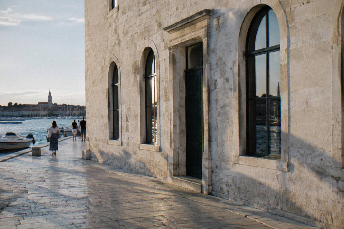 A pale stone building with arched windows in Zadar old town