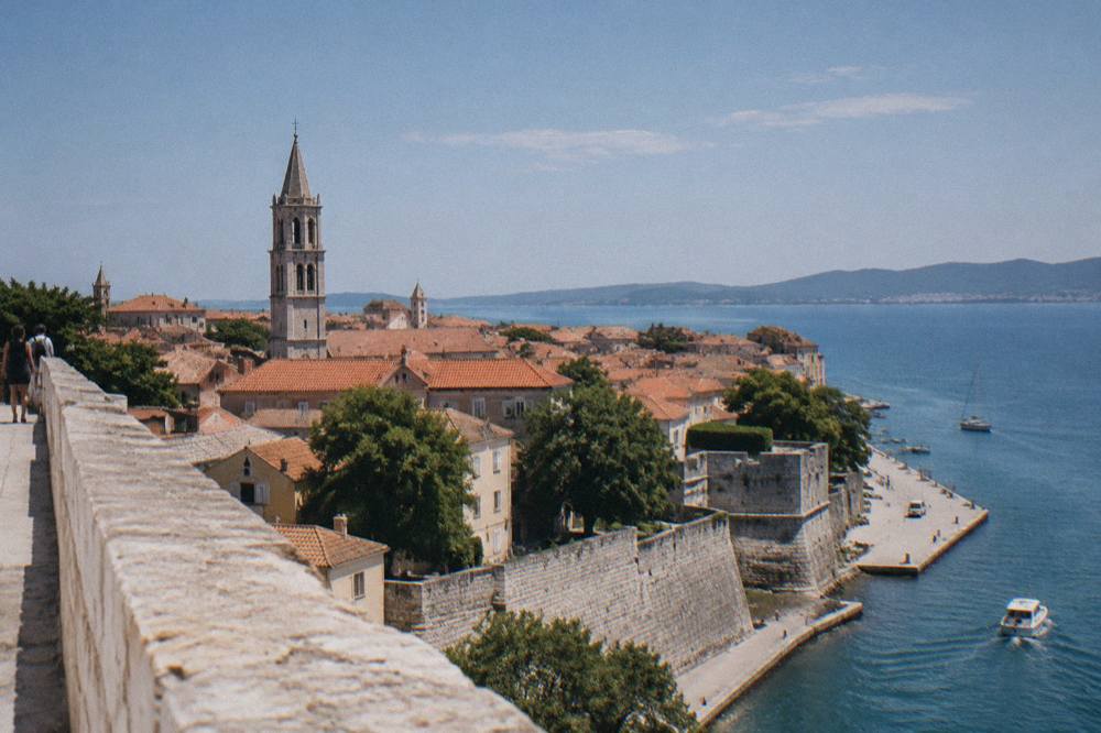Old Town rooftops and bell tower seen from a high bastion wall