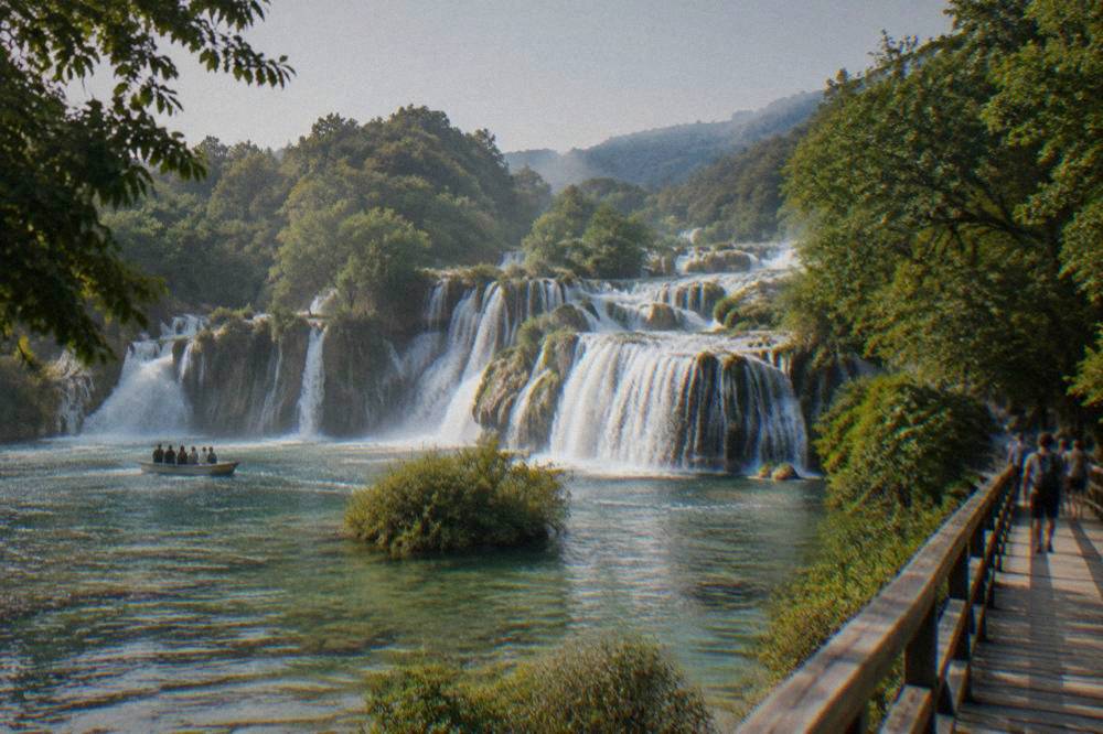 Skradinski Buk travertine falls into a green pool with boardwalks