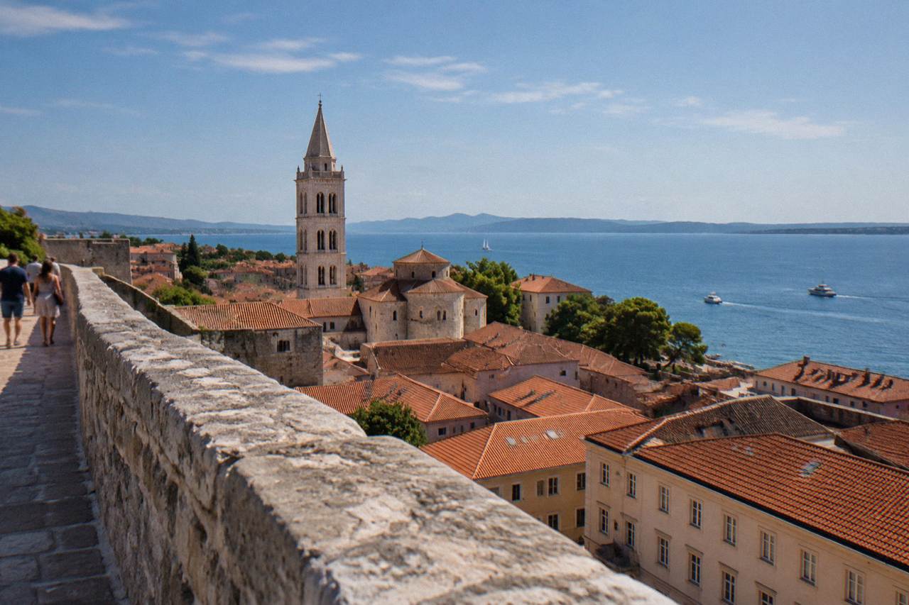 Old Town rooftops and bell tower from a high bastion wall