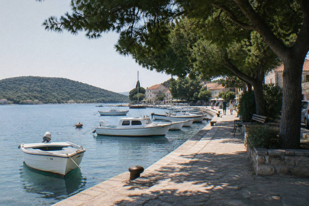 Preko harbour on Ugljan with a stone quay and green hills